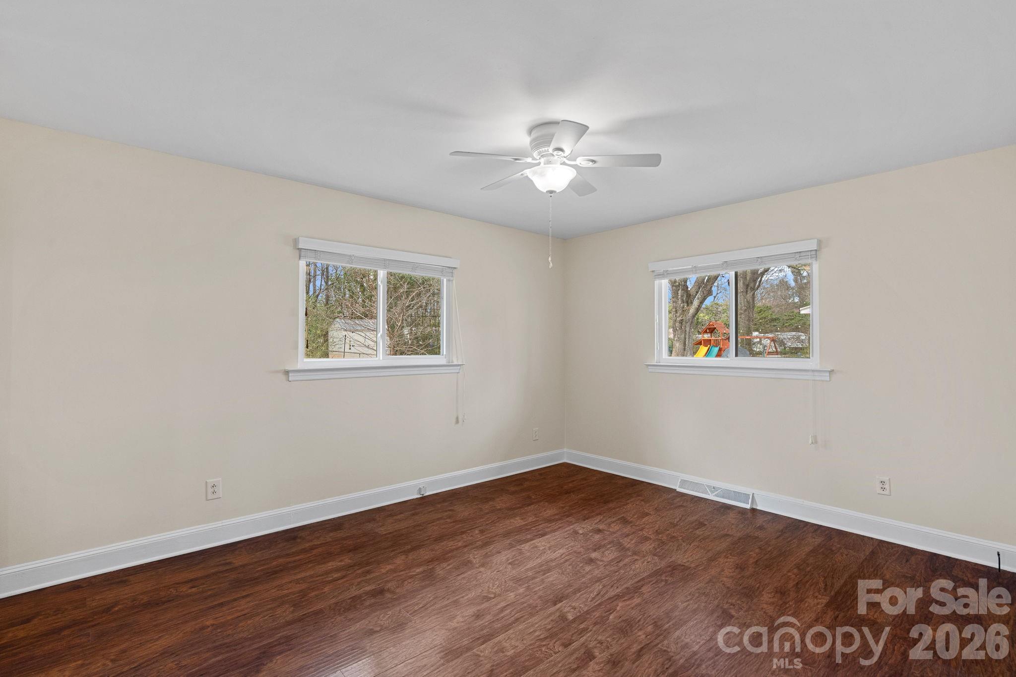 337 Fieldstone Road Mooresville, NC 28115 - Photo 13 of 25 a view of empty room with wooden floor and fan