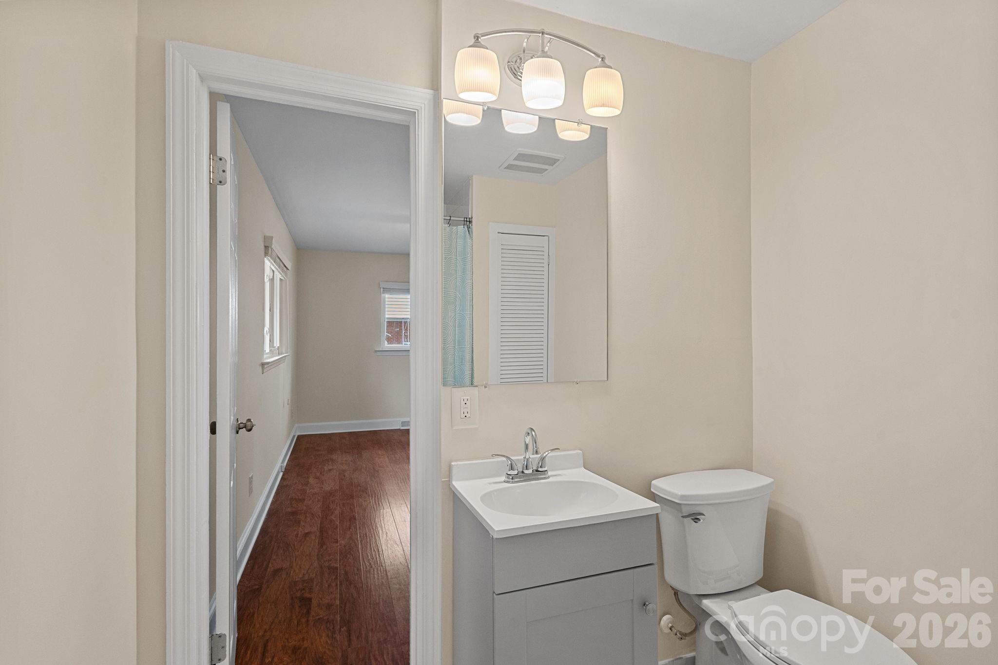 337 Fieldstone Road Mooresville, NC 28115 - Photo 15 of 25 a bathroom with a toilet sink and mirror