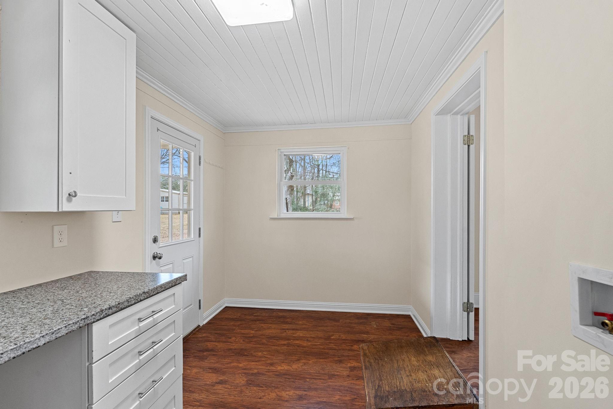 337 Fieldstone Road Mooresville, NC 28115 - Photo 17 of 25 a kitchen with granite countertop white cabinets and sink