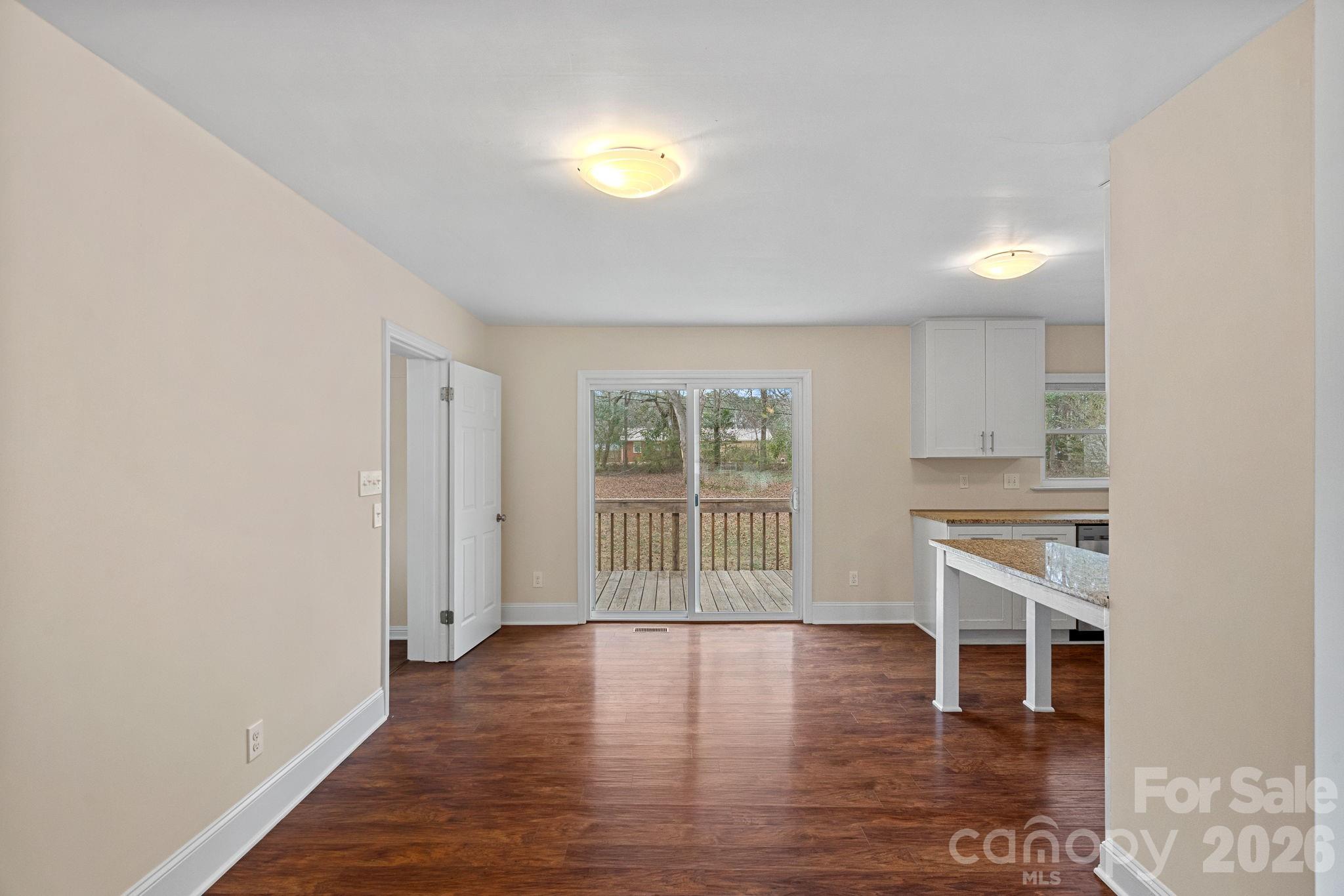 337 Fieldstone Road Mooresville, NC 28115 - Photo 9 of 25 an empty room with wooden floor and windows