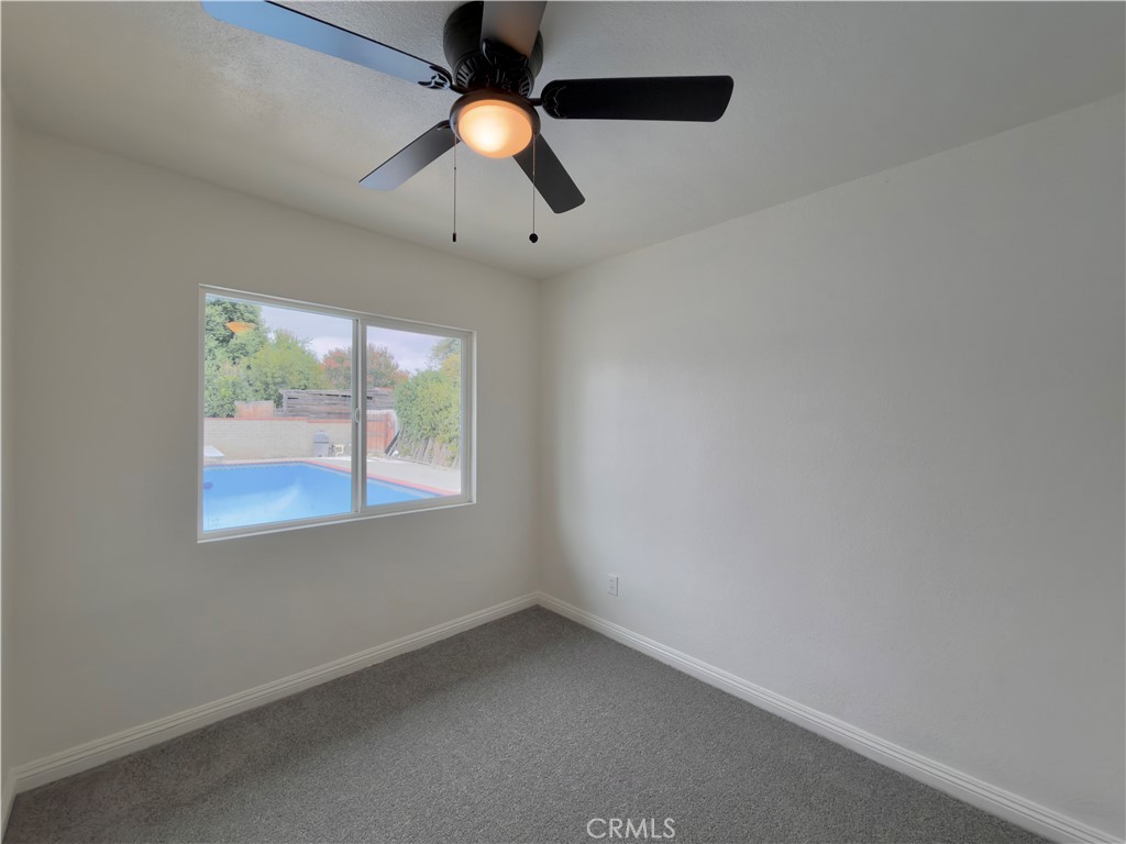 332 East Rosewood Street Rialto, CA 92376 - Photo 11 of 22 an empty room with a window