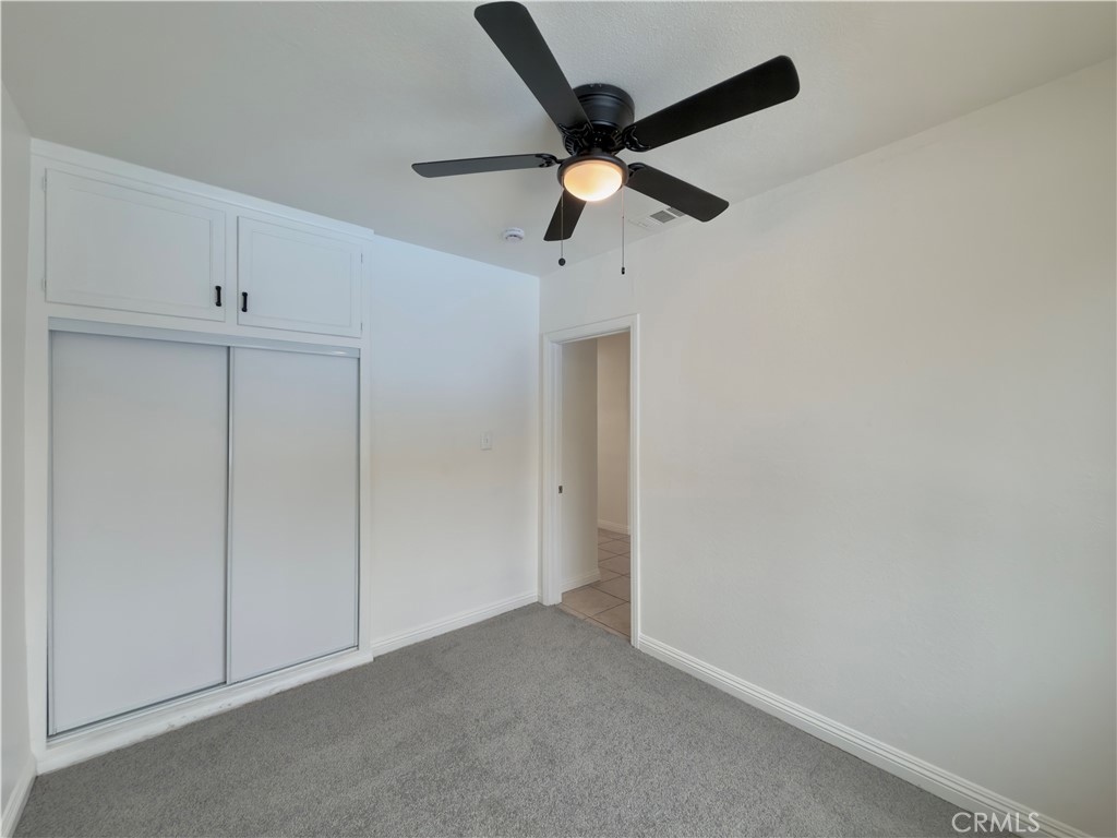 332 East Rosewood Street Rialto, CA 92376 - Photo 12 of 22 an empty room with closet