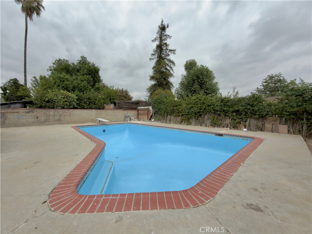332 East Rosewood Street Rialto, CA 92376 - Photo 18 of 22 a view of a swimming pool with an outdoor seating