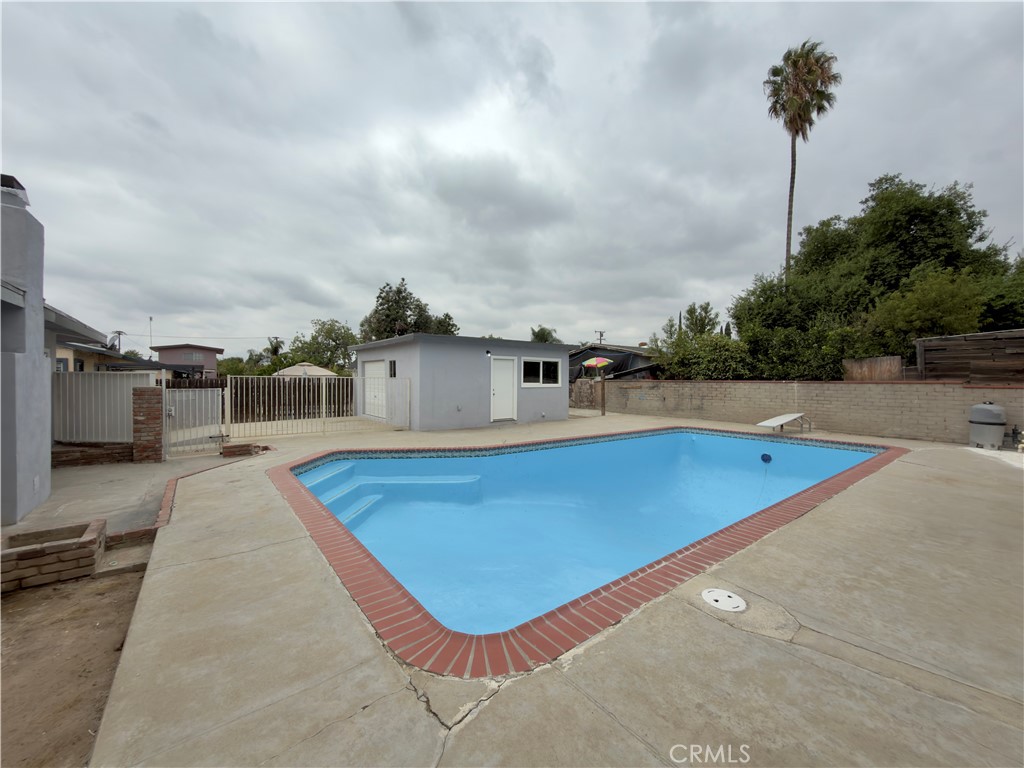 332 East Rosewood Street Rialto, CA 92376 - Photo 19 of 22 a view of a swimming pool with a chair