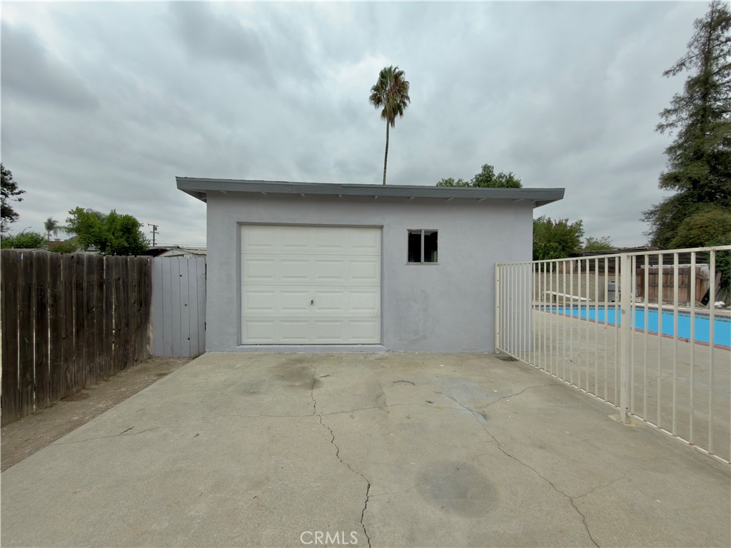 332 East Rosewood Street Rialto, CA 92376 - Photo 22 of 22 a view of a house with a garage