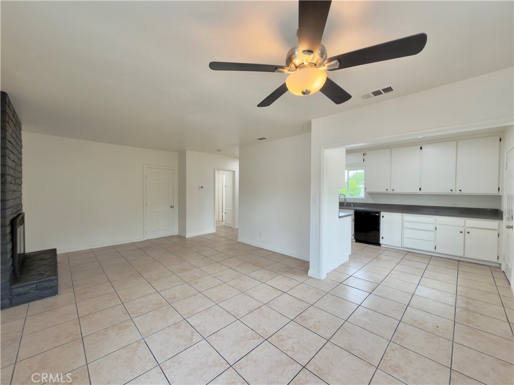 332 East Rosewood Street Rialto, CA 92376 - Photo 5 of 22 a view of a kitchen with a sink and cabinets
