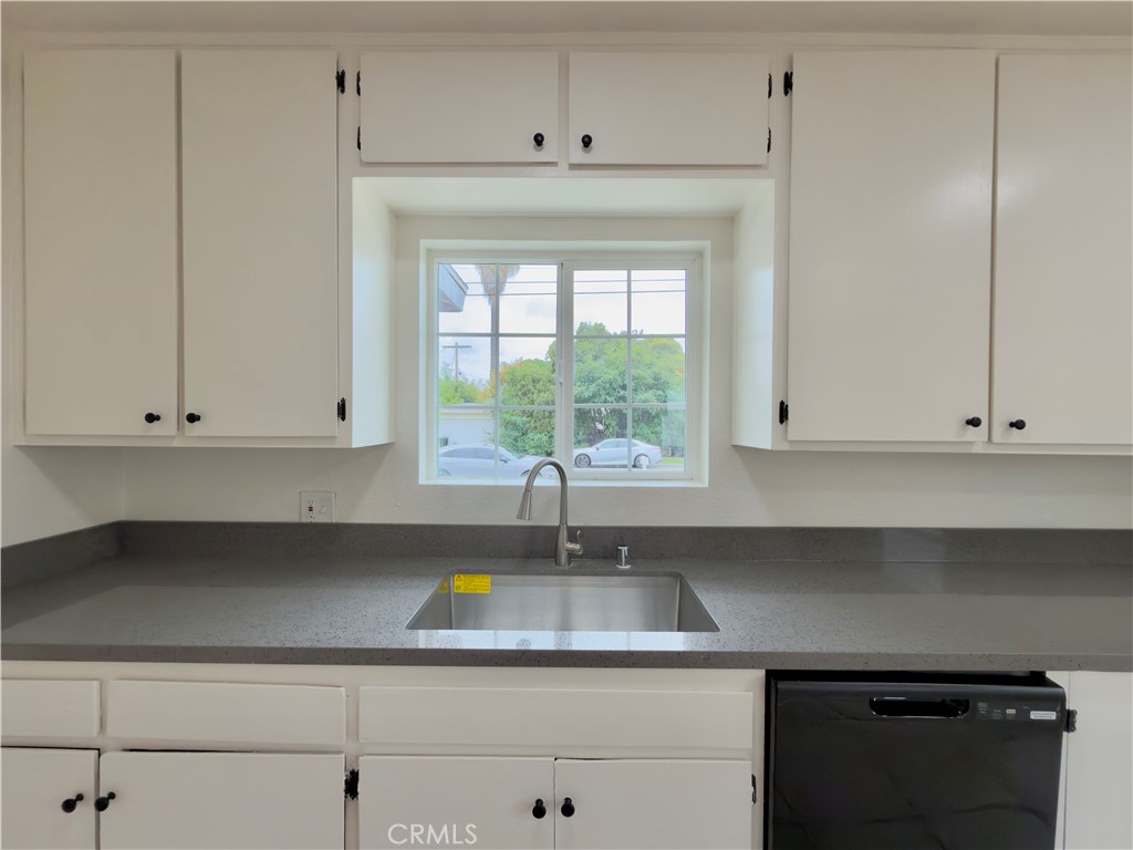 332 East Rosewood Street Rialto, CA 92376 - Photo 8 of 22 a kitchen with a white cabinets and window