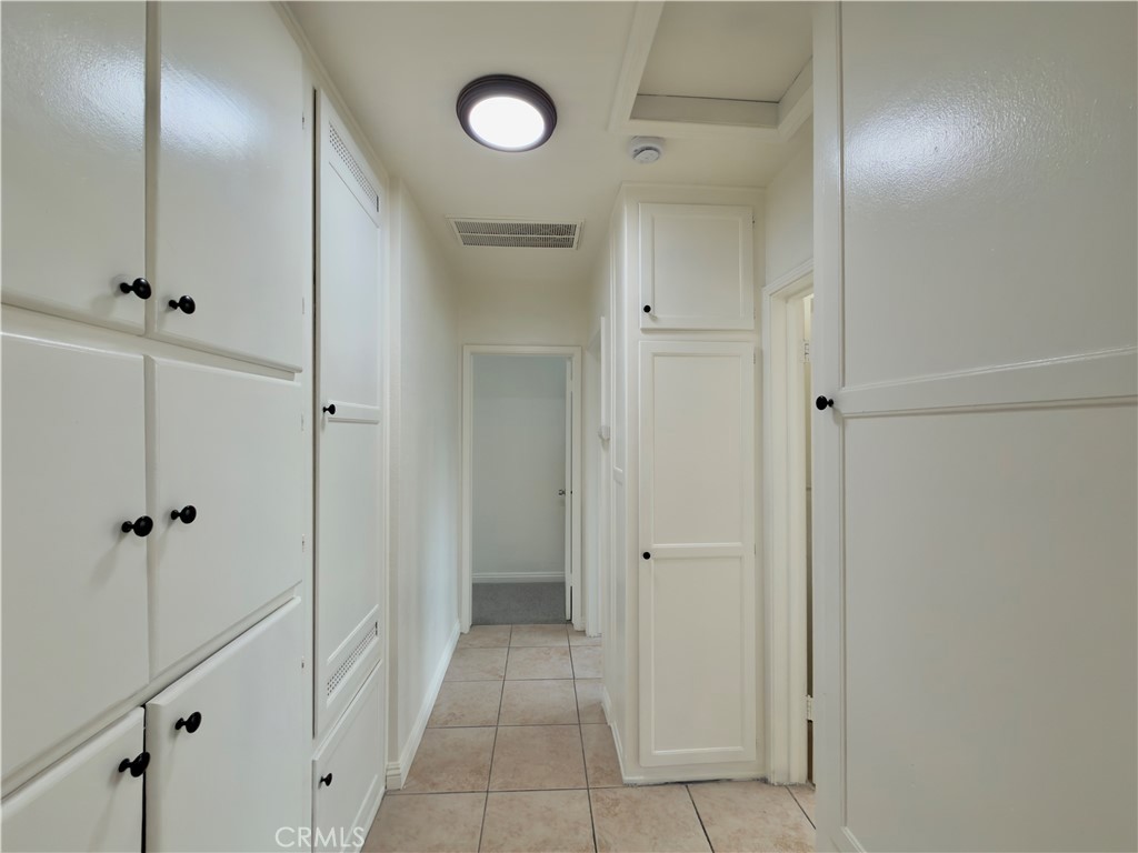 332 East Rosewood Street Rialto, CA 92376 - Photo 10 of 22 a bathroom with a shower and a glass door