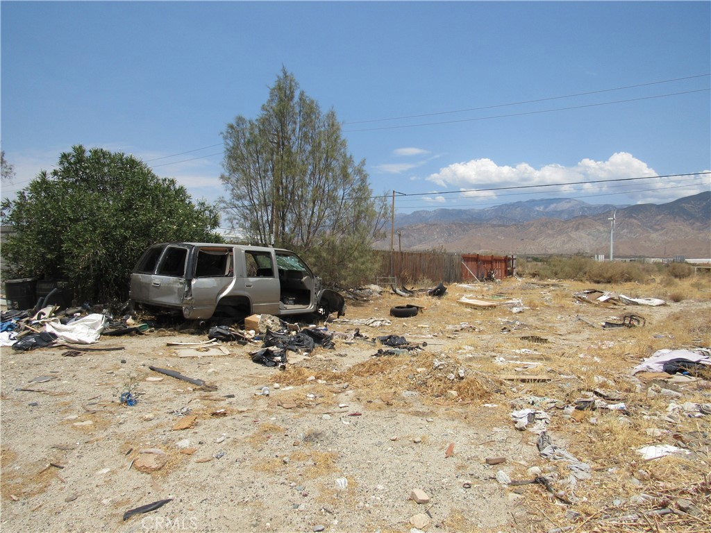 a view of a backyard of the house