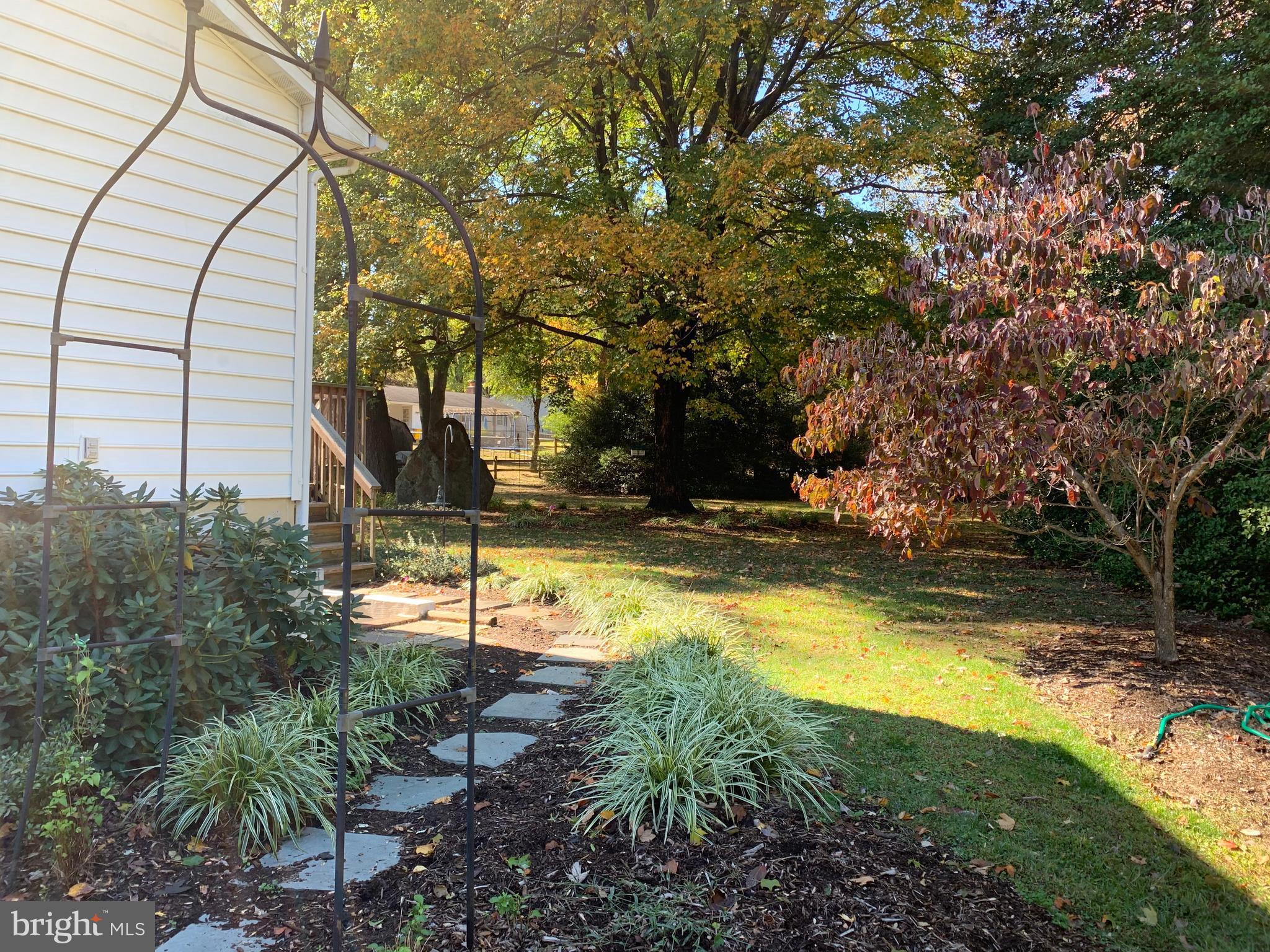 7978 Holly Road Pasadena, MD 21122 - Photo 26 of 29 Side walkway from driveway to back yard