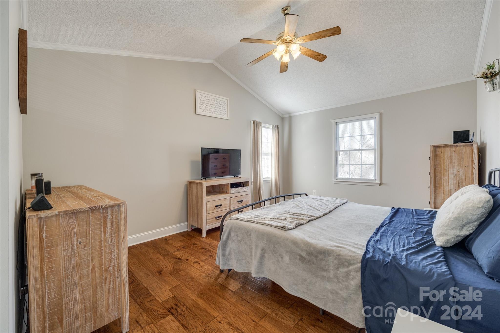 2801 Briar Ridge Drive Charlotte, NC 28270 - Photo 17 of 32 a spacious bedroom with a bed a window and a television