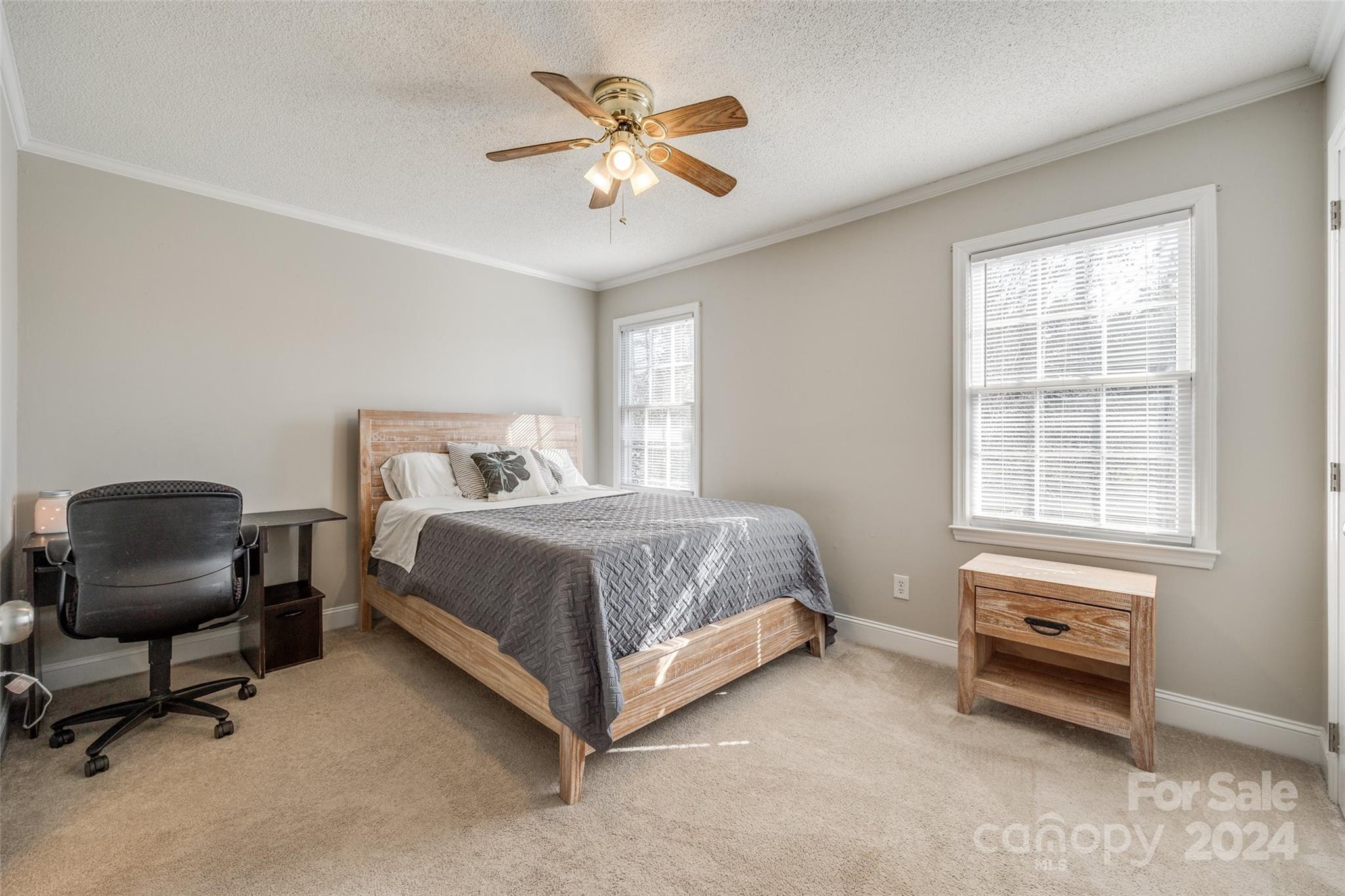 2801 Briar Ridge Drive Charlotte, NC 28270 - Photo 25 of 32 a bedroom with a bed and a chair