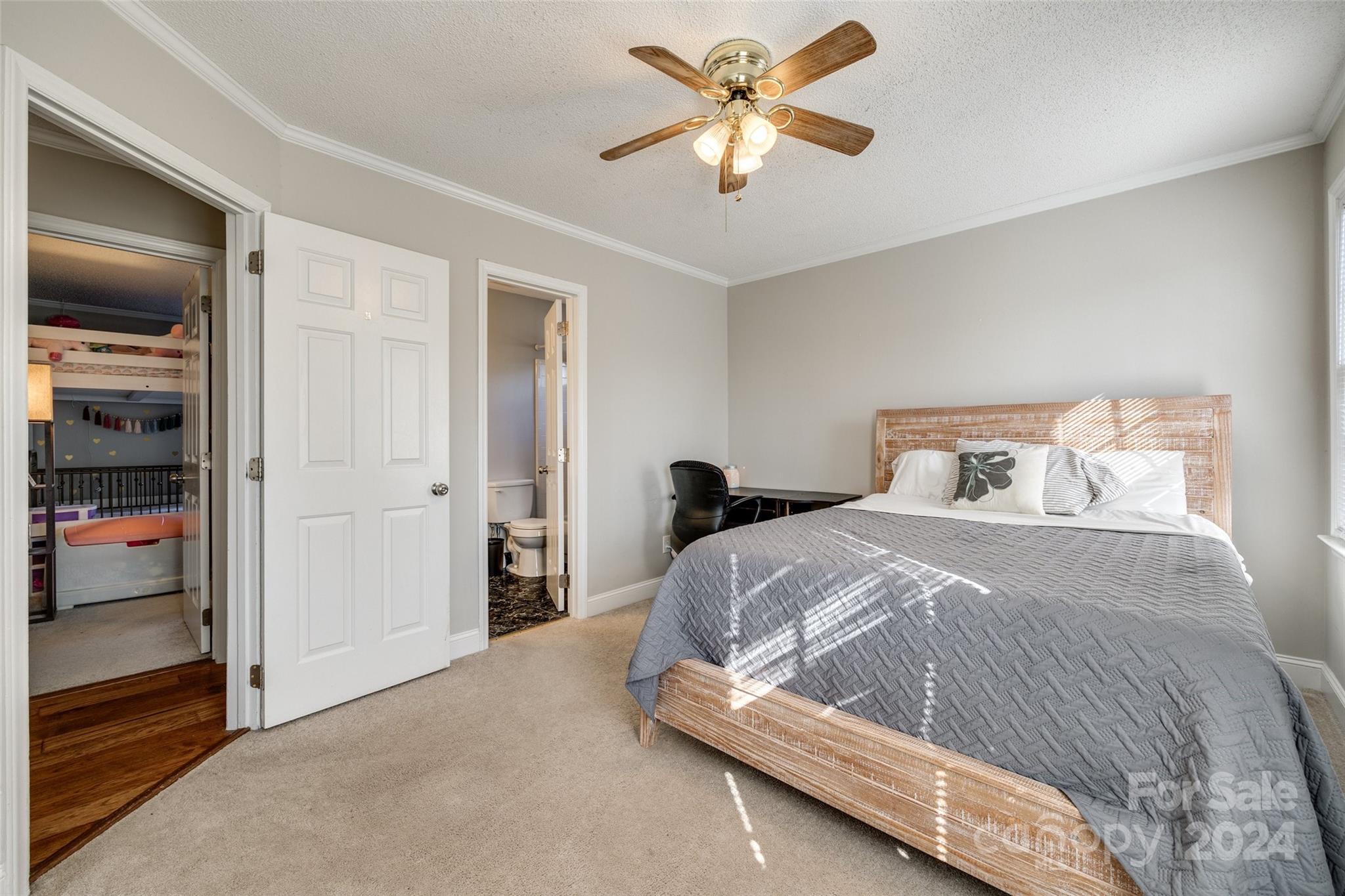 2801 Briar Ridge Drive Charlotte, NC 28270 - Photo 26 of 32 a bedroom with a bed and a chandelier