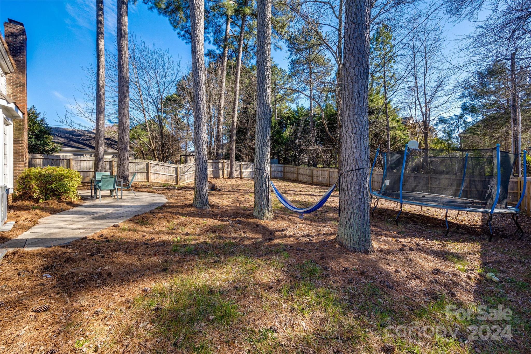 2801 Briar Ridge Drive Charlotte, NC 28270 - Photo 29 of 32 a view of a street with a bench and trees