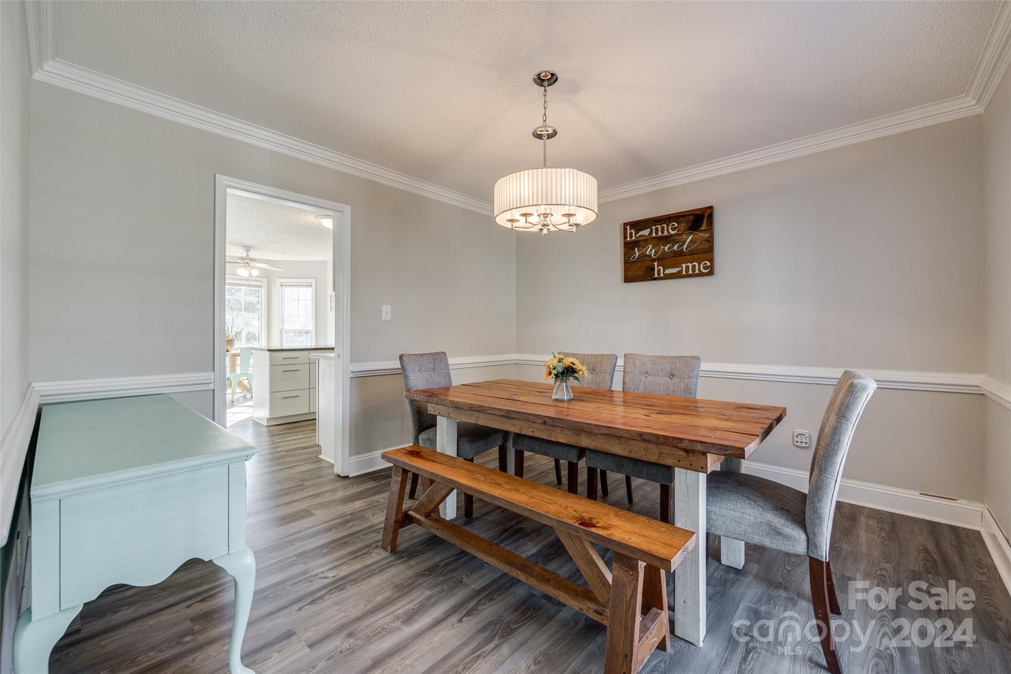 2801 Briar Ridge Drive Charlotte, NC 28270 - Photo 9 of 32 a view of a dining room with furniture and wooden floor