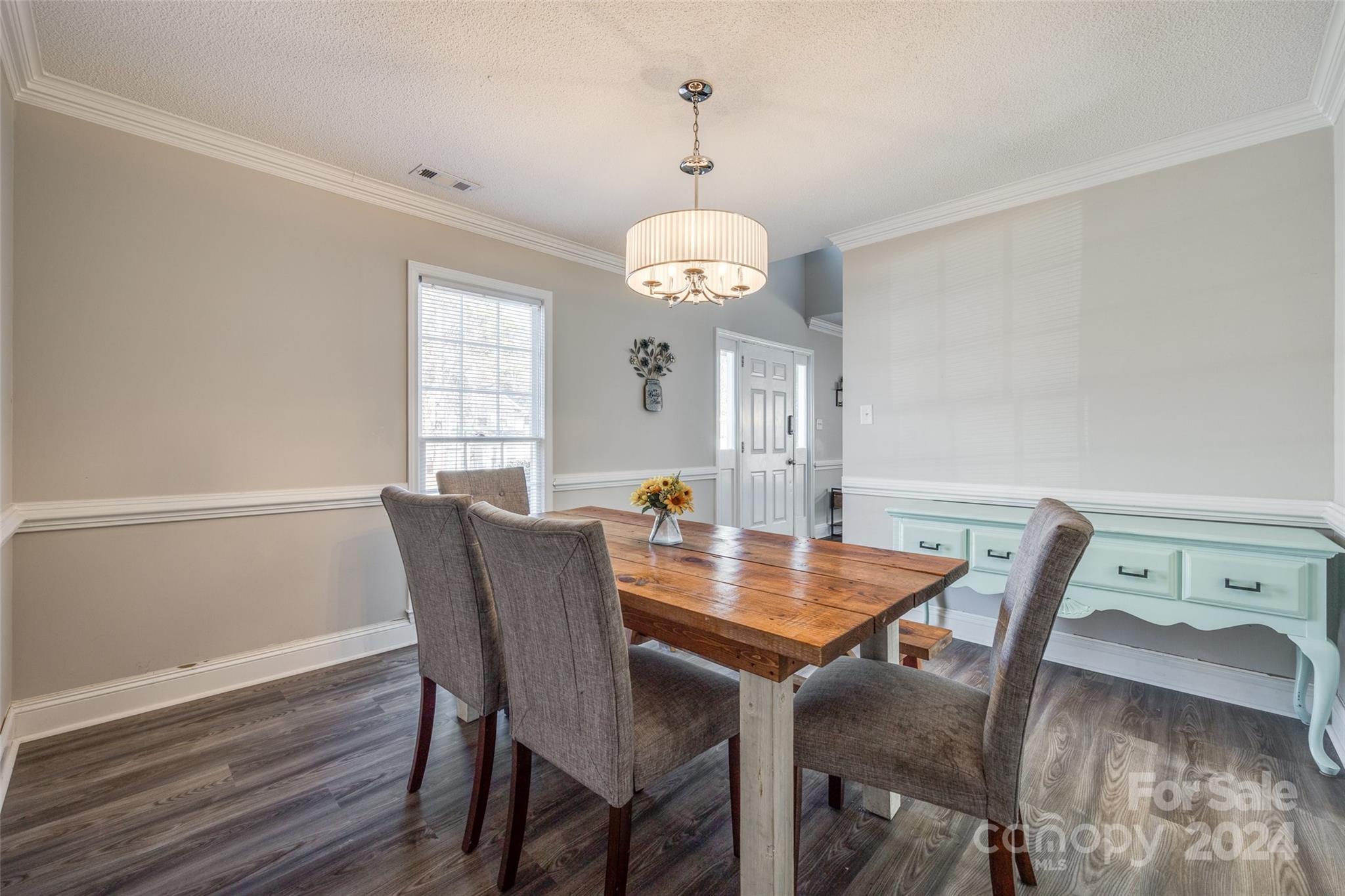2801 Briar Ridge Drive Charlotte, NC 28270 - Photo 10 of 32 a view of a dining room with furniture window and wooden floor