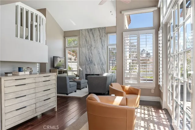 a kitchen with stainless steel appliances granite countertop a refrigerator sink and white cabinets