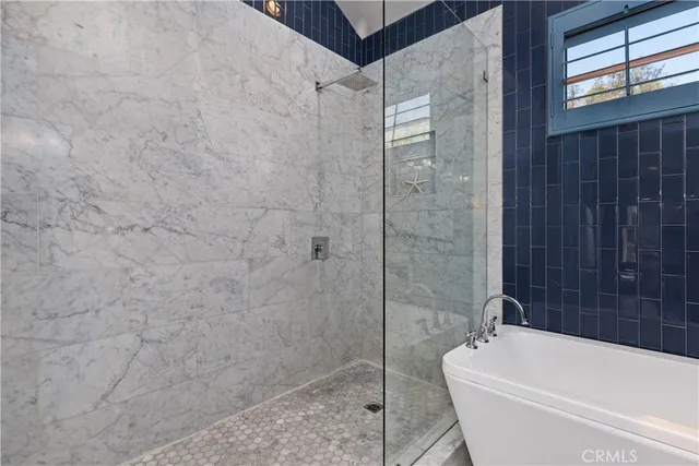 a white bath tub sitting in a bathroom