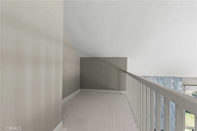 a reading room with furniture a window and a table