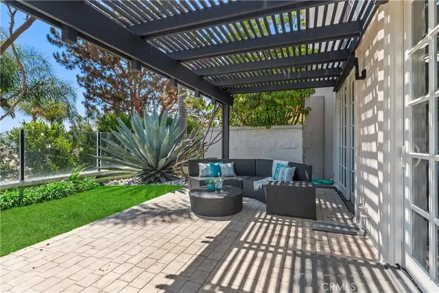 a view of a house with backyard sitting area and garden