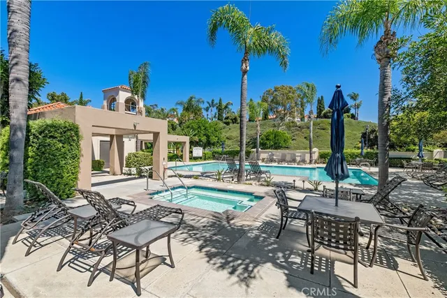a view of a building with sitting area and garden