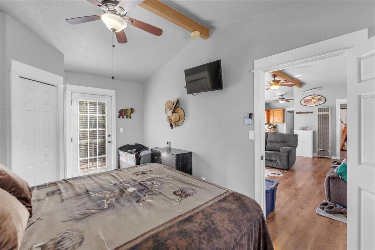 16150 Jellys Ferry Road Red Bluff, CA 96080 - Photo 12 of 37 a bedroom with a bed and a flat tv screen on dresser
