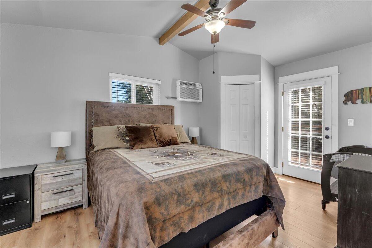 16150 Jellys Ferry Road Red Bluff, CA 96080 - Photo 13 of 37 a bedroom with a large bed and a window