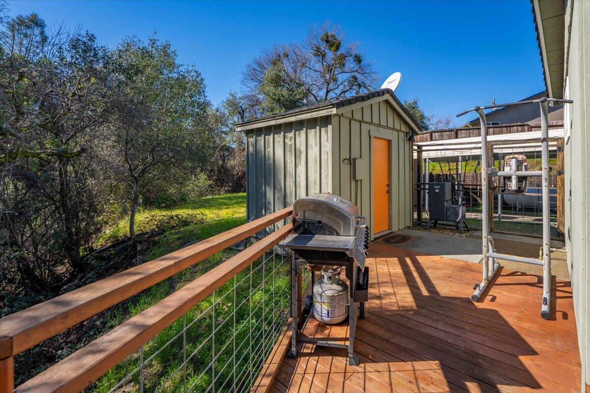 16150 Jellys Ferry Road Red Bluff, CA 96080 - Photo 21 of 37 a view of balcony with wooden floor and outdoor seating