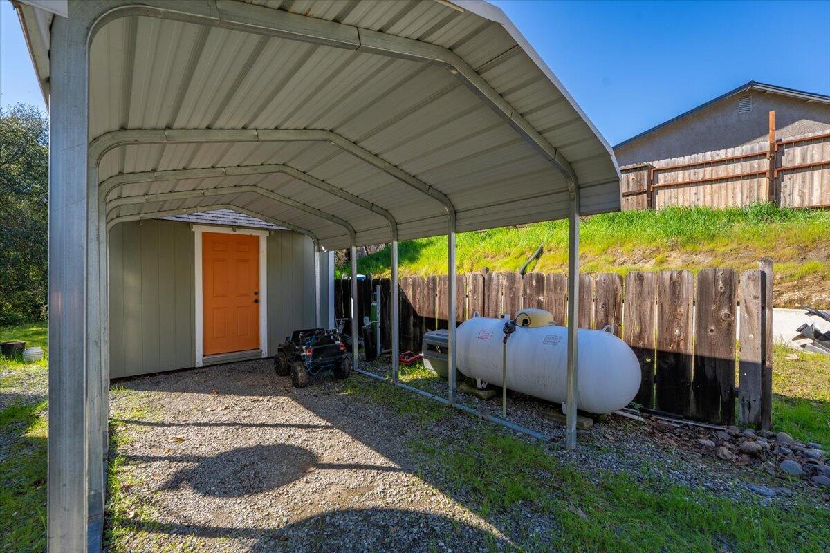 16150 Jellys Ferry Road Red Bluff, CA 96080 - Photo 22 of 37 a backyard of a house with yard and outdoor seating