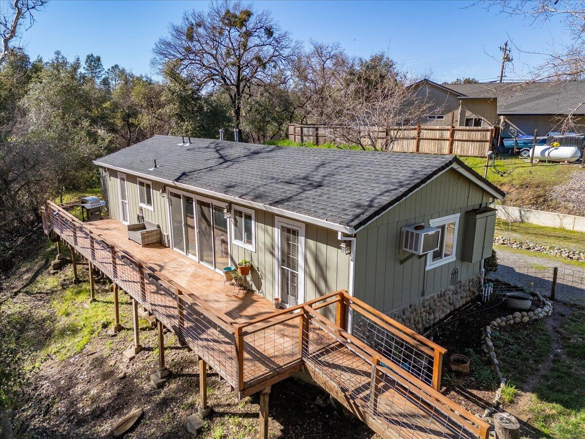 16150 Jellys Ferry Road Red Bluff, CA 96080 - Photo 32 of 37 a aerial view of a house with table and chairs under an umbrella