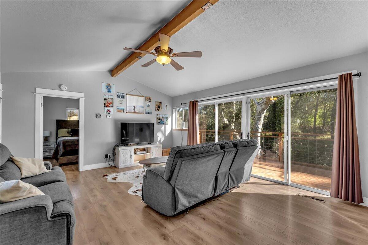 16150 Jellys Ferry Road Red Bluff, CA 96080 - Photo 4 of 37 a living room with furniture large window and flat screen tv