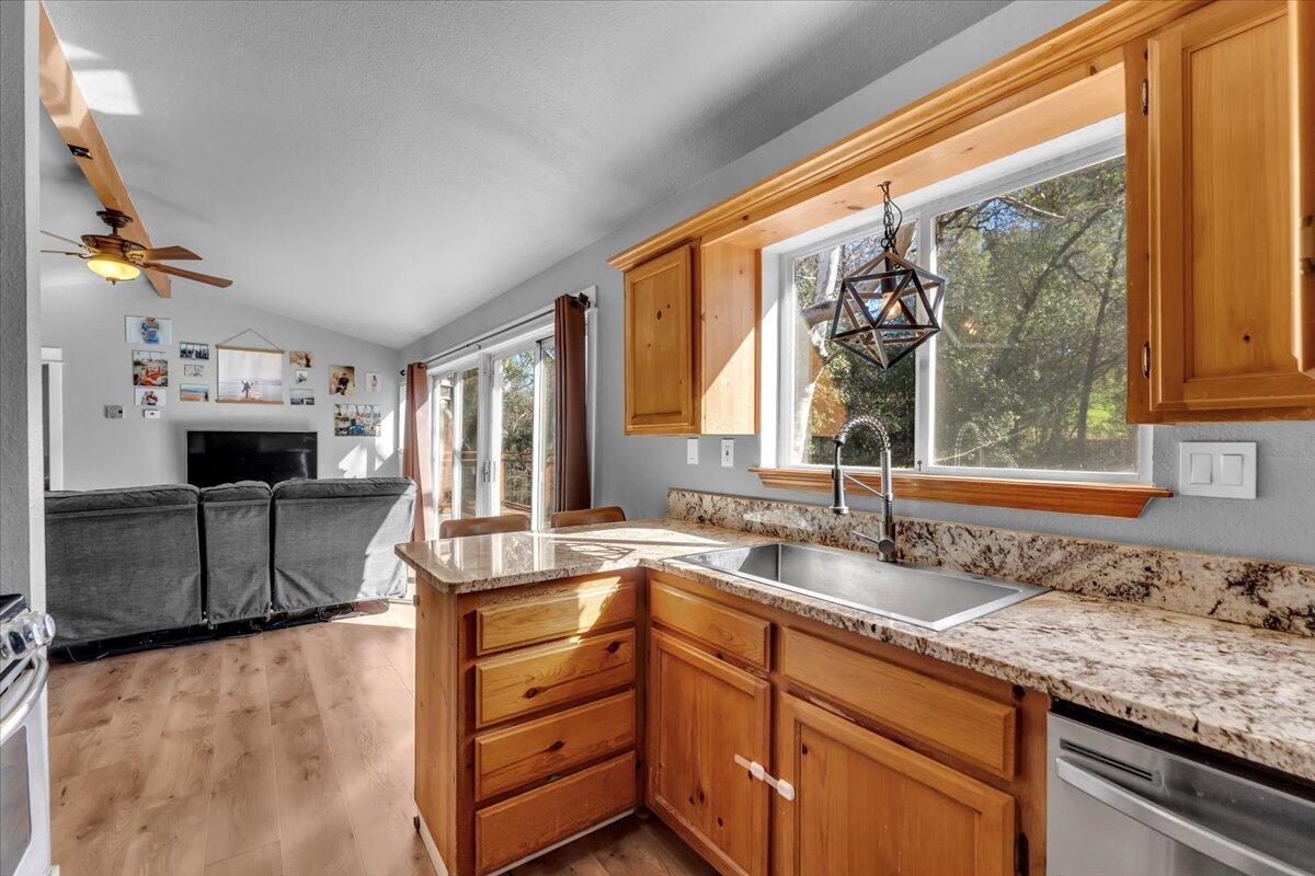 16150 Jellys Ferry Road Red Bluff, CA 96080 - Photo 6 of 37 a kitchen with granite countertop a sink and a window