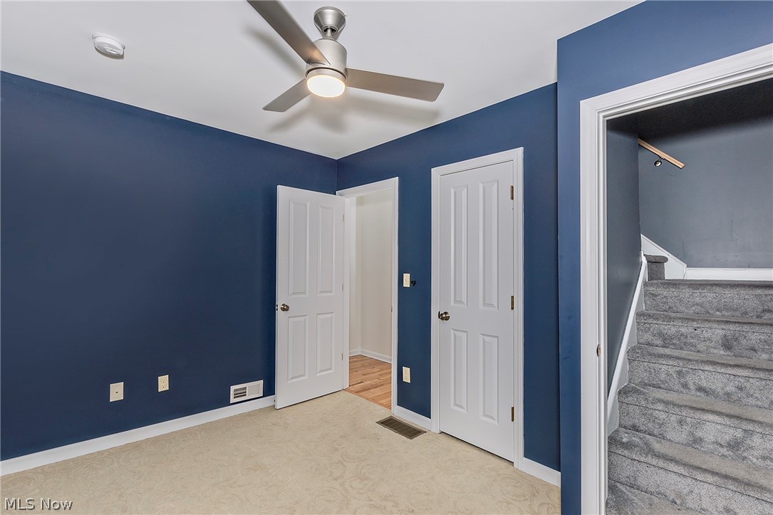 917 Brunswick Road Cleveland Heights, OH 44112 - Photo 33 of 42 Bedroom three with closet, ceiling fan and access to the third floor bonus room.