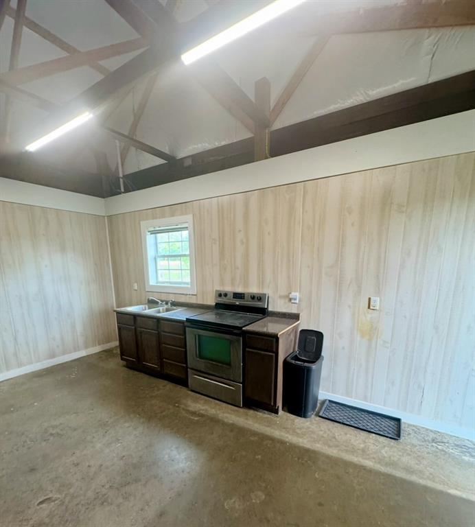 642 Fm 1995 Van, TX 75790 - Photo 25 of 28 a kitchen with kitchen island granite countertop a stove and a sink