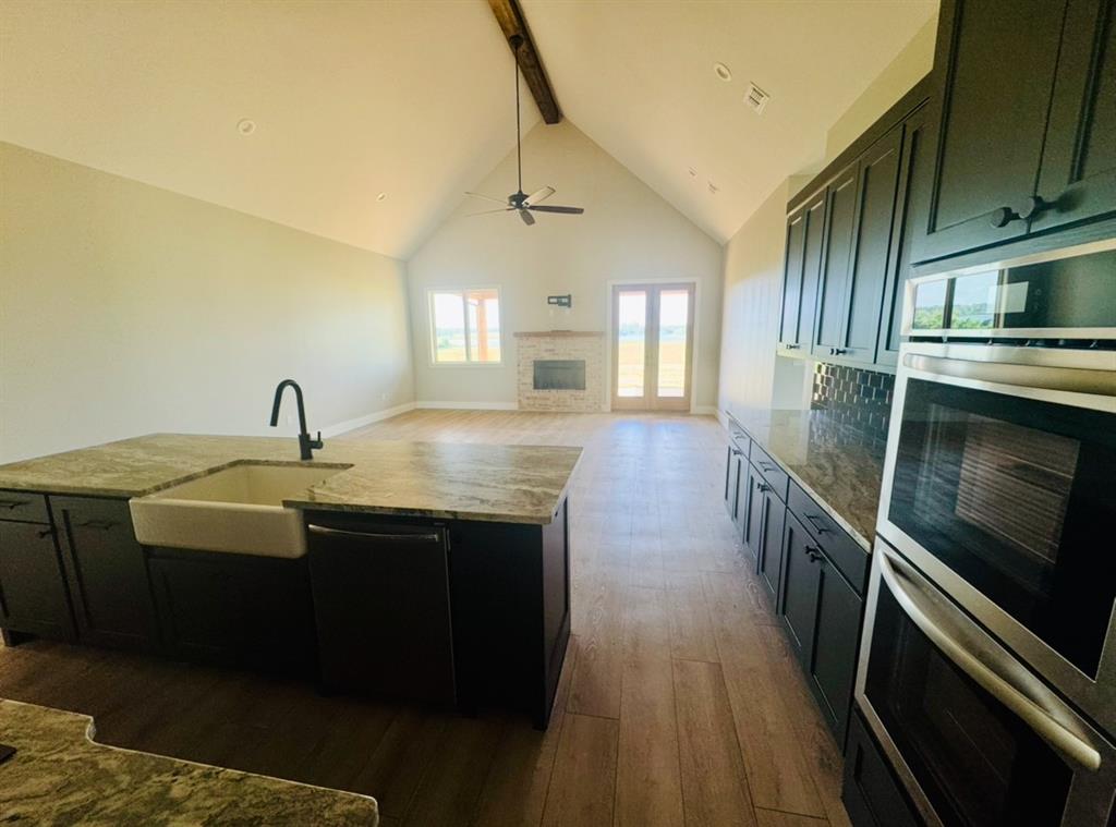 642 Fm 1995 Van, TX 75790 - Photo 7 of 28 a kitchen with stainless steel appliances a sink stove and cabinets