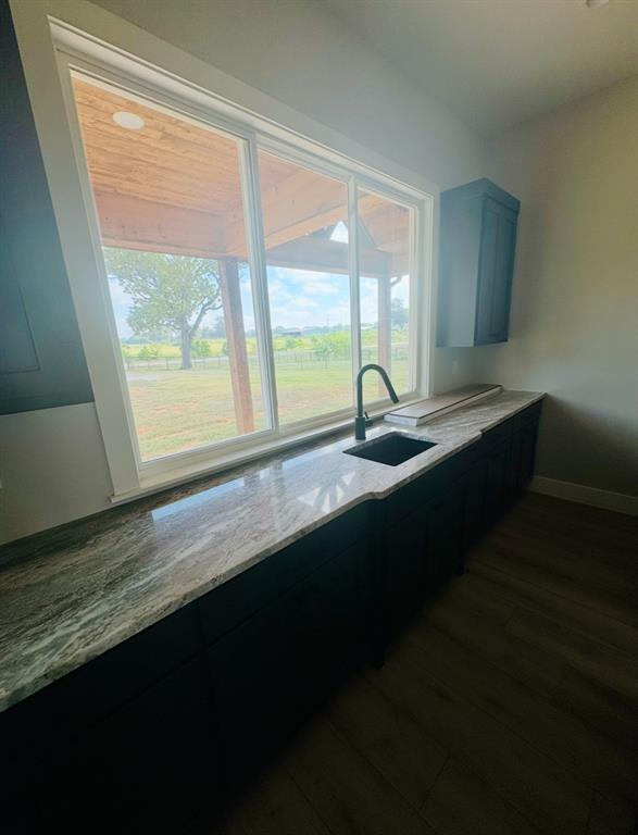 642 Fm 1995 Van, TX 75790 - Photo 10 of 28 a kitchen with granite countertop sink and window