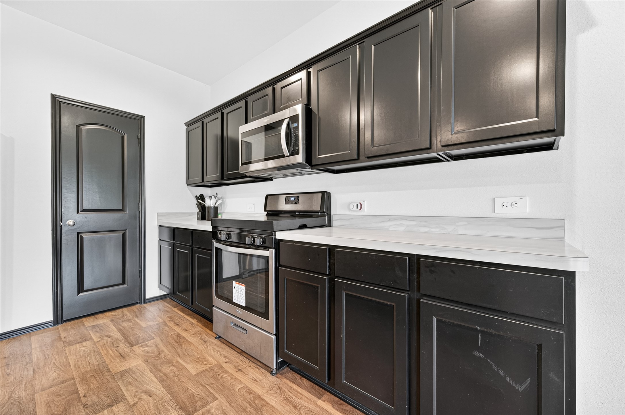 21538 Violet Rdg Road Katy, TX 77449 - Photo 14 of 39 a kitchen with stainless steel appliances granite countertop a refrigerator and a sink
