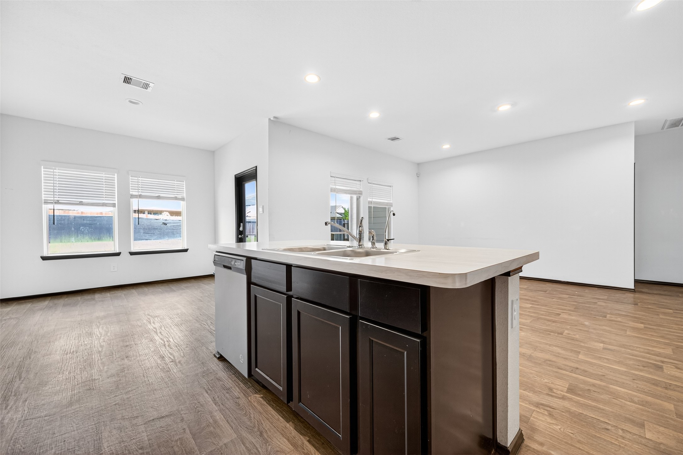 21538 Violet Rdg Road Katy, TX 77449 - Photo 15 of 39 a kitchen with a sink cabinets and wooden floor