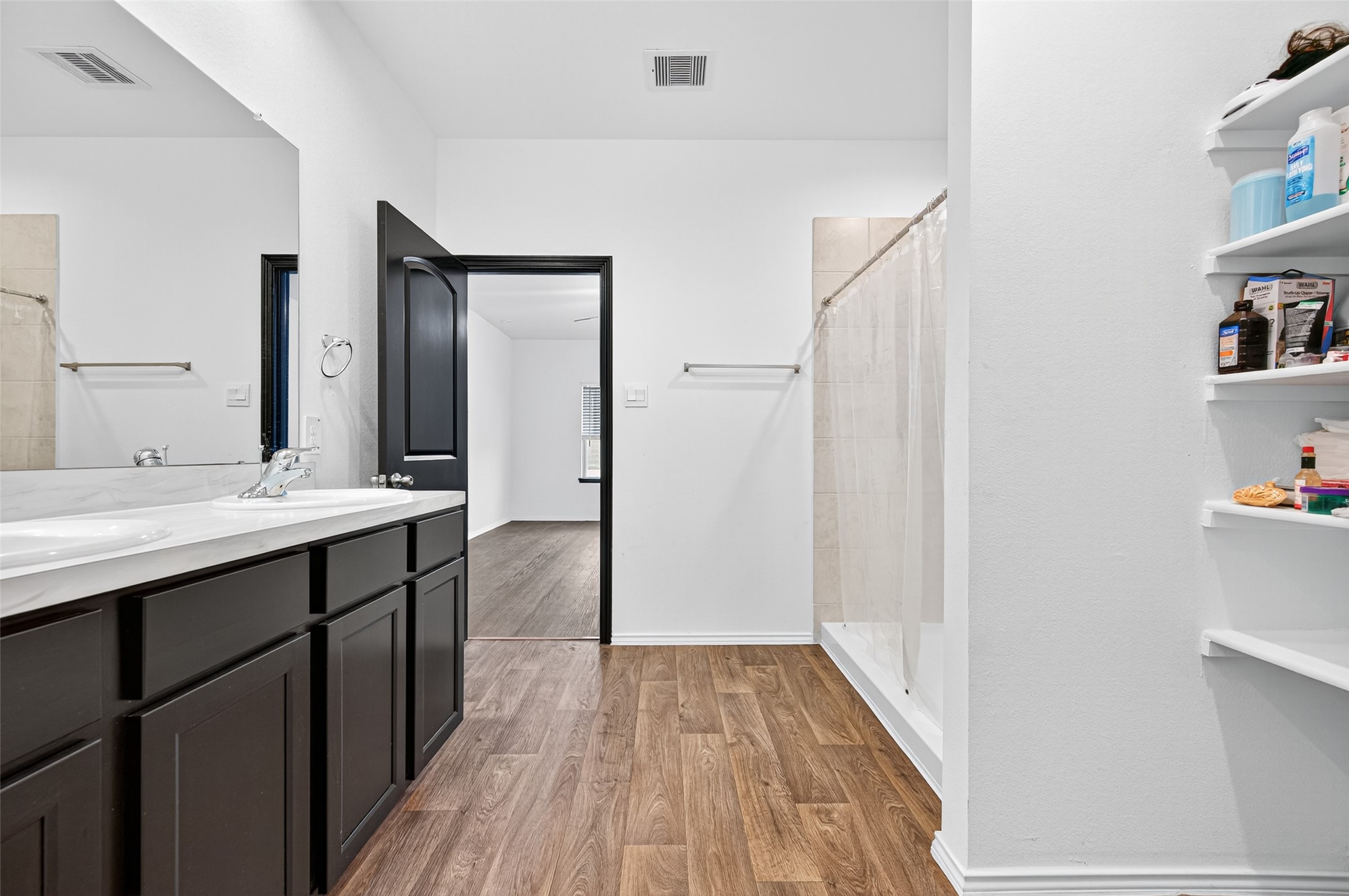 21538 Violet Rdg Road Katy, TX 77449 - Photo 21 of 39 a bathroom with a sink and a mirror