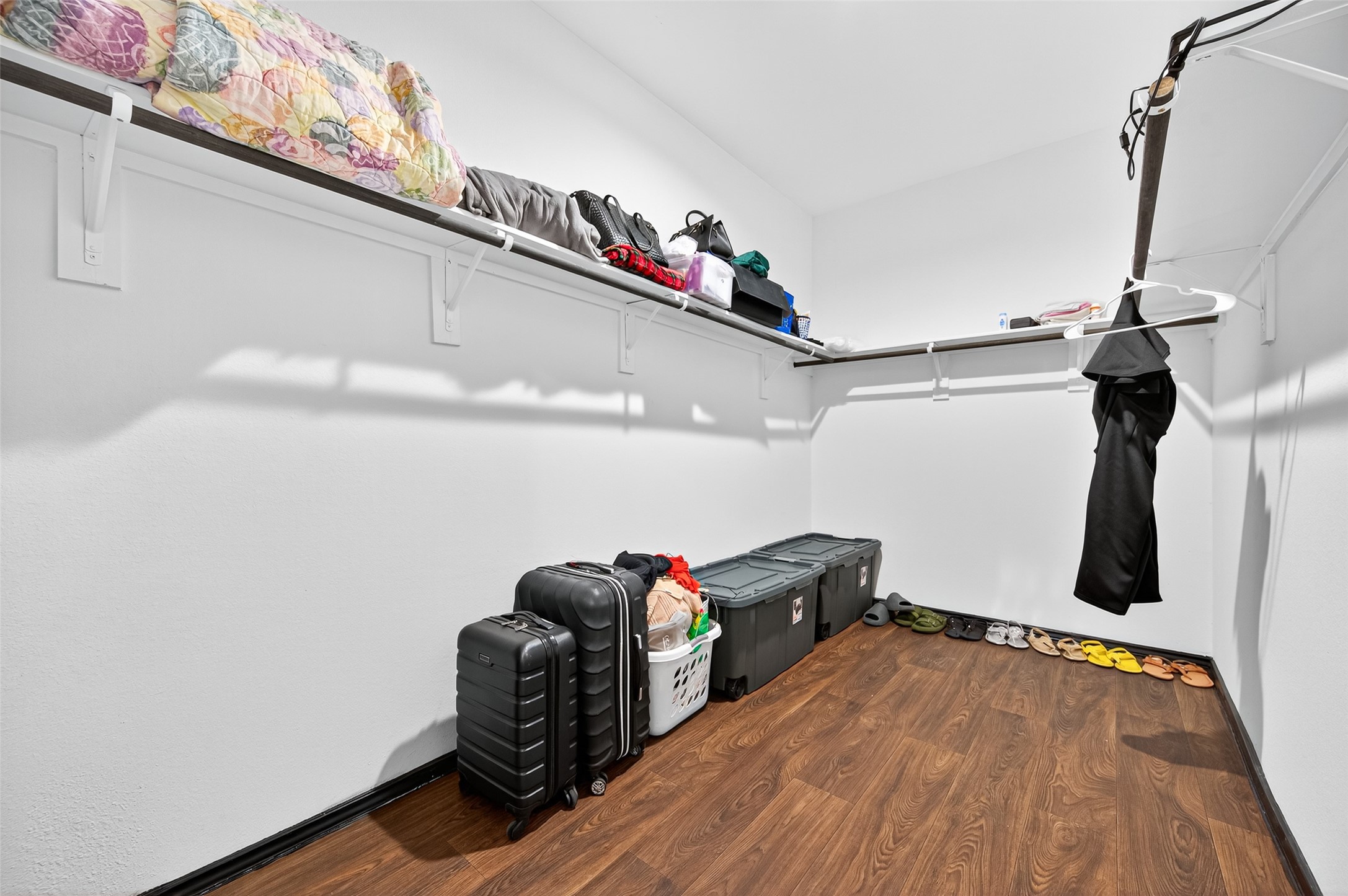 21538 Violet Rdg Road Katy, TX 77449 - Photo 23 of 39 a view of walk in closet with clothes and shoes