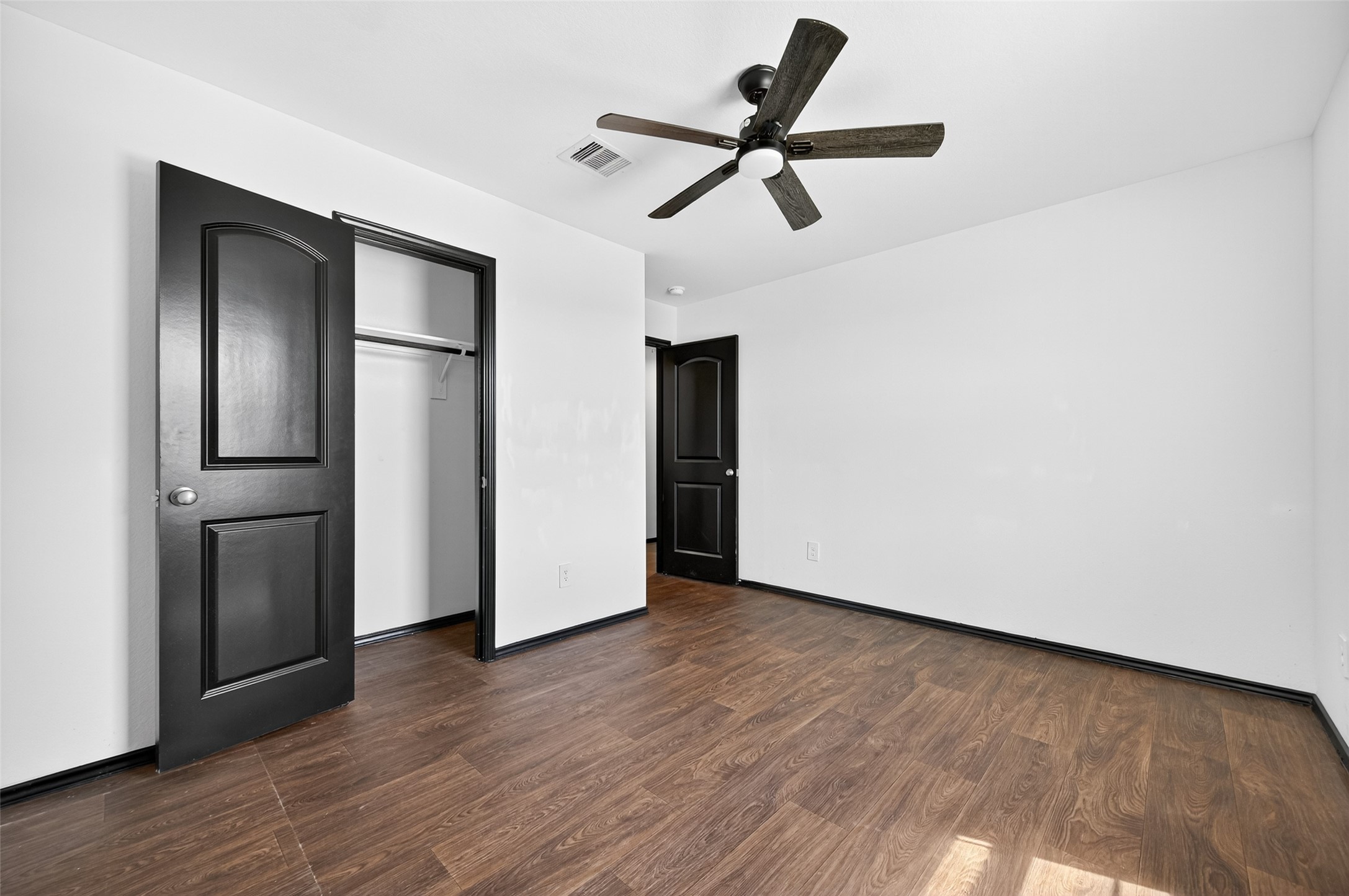 21538 Violet Rdg Road Katy, TX 77449 - Photo 28 of 39 a view of a livingroom with wooden floor and a ceiling fan