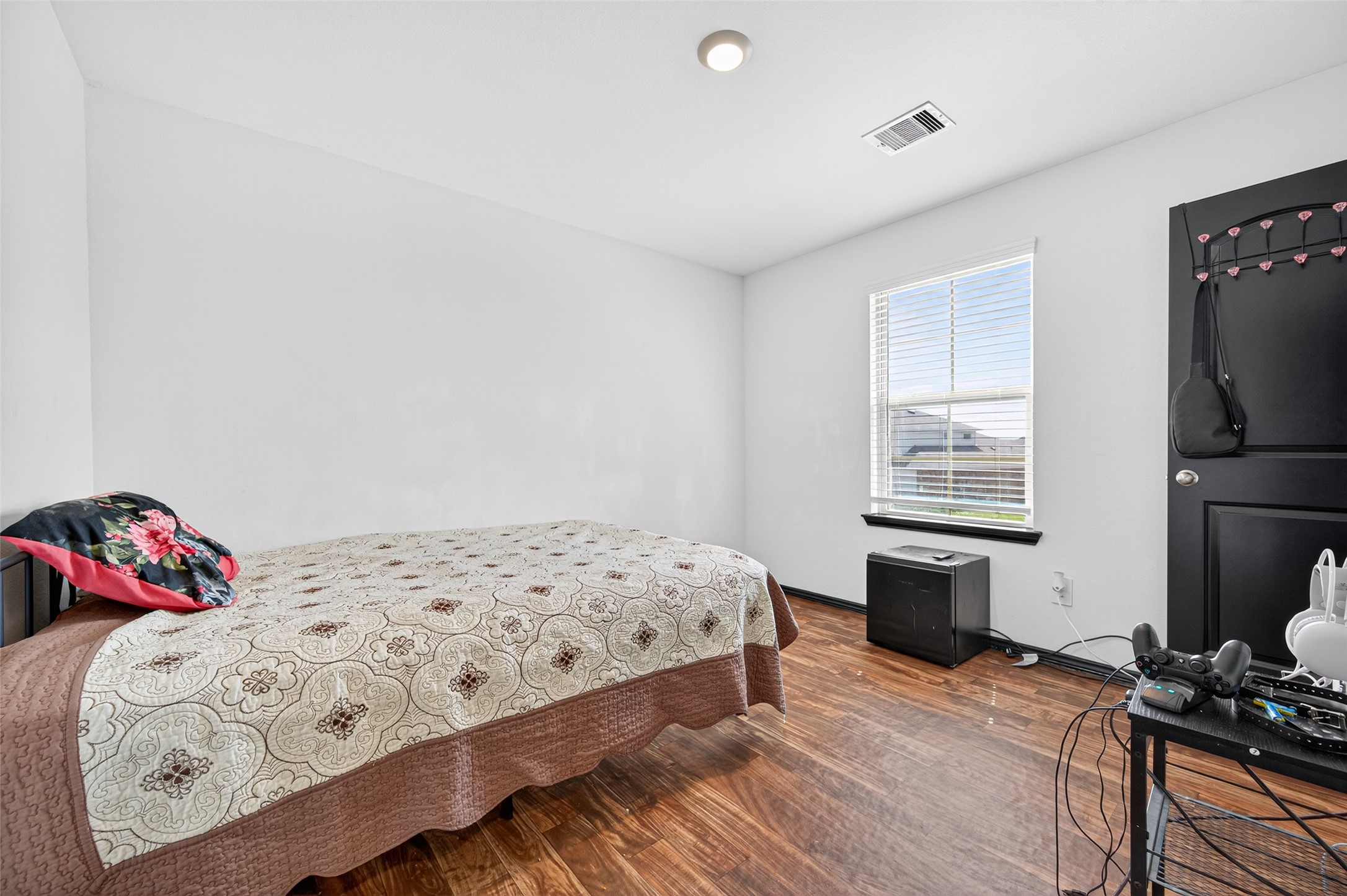 21538 Violet Rdg Road Katy, TX 77449 - Photo 31 of 39 a bedroom with a bed and a window