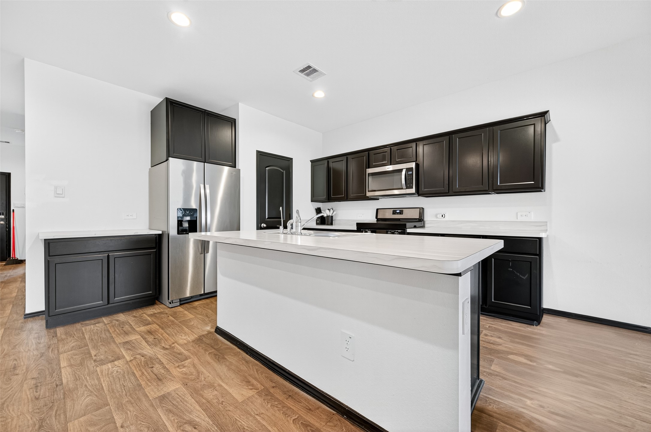 21538 Violet Rdg Road Katy, TX 77449 - Photo 10 of 39 a kitchen with kitchen island a counter top space appliances and cabinets