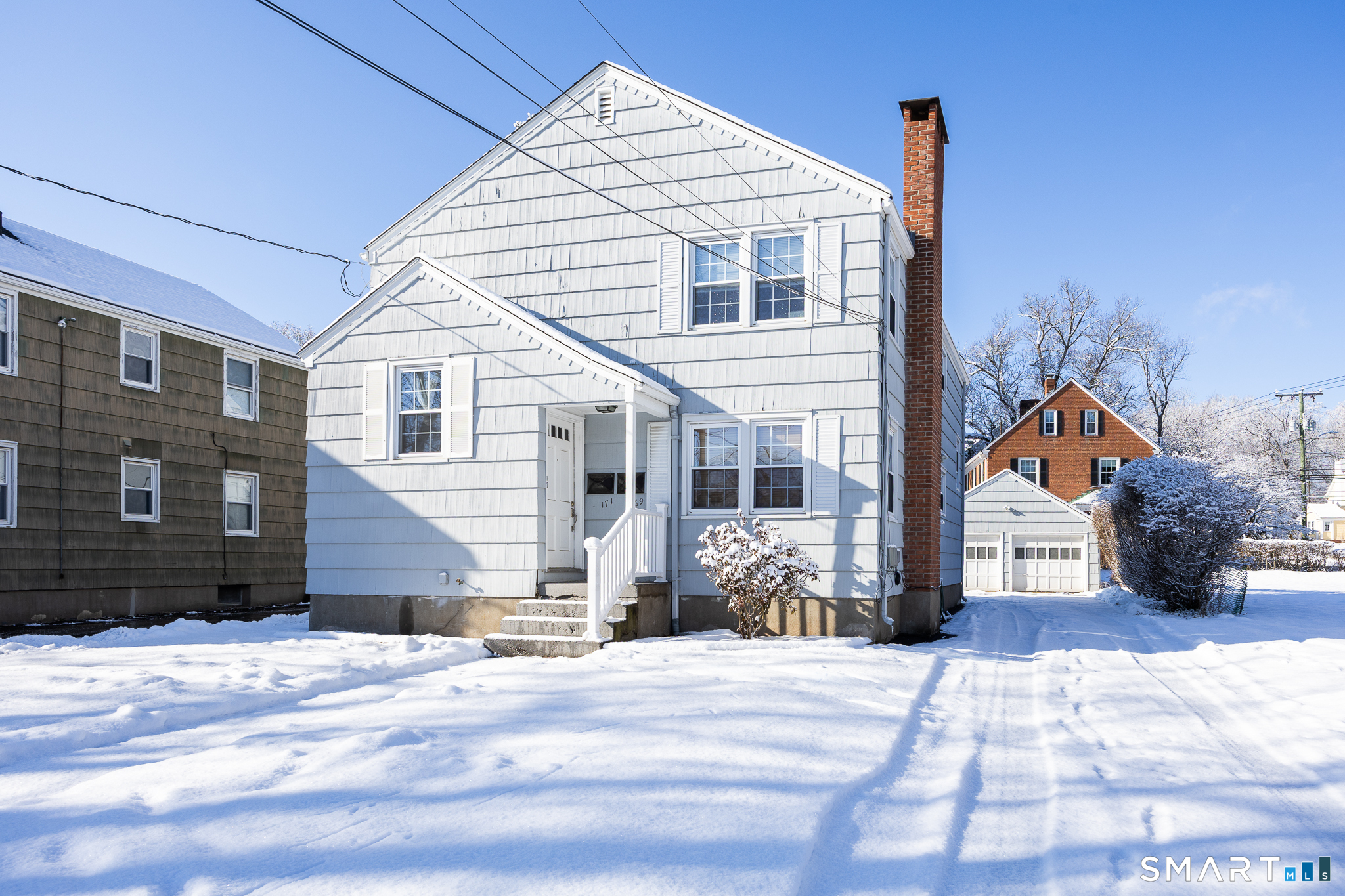 169 Arnoldale Road West Hartford, CT 06119 - Photo 2 of 11 a front view of a house with a yard