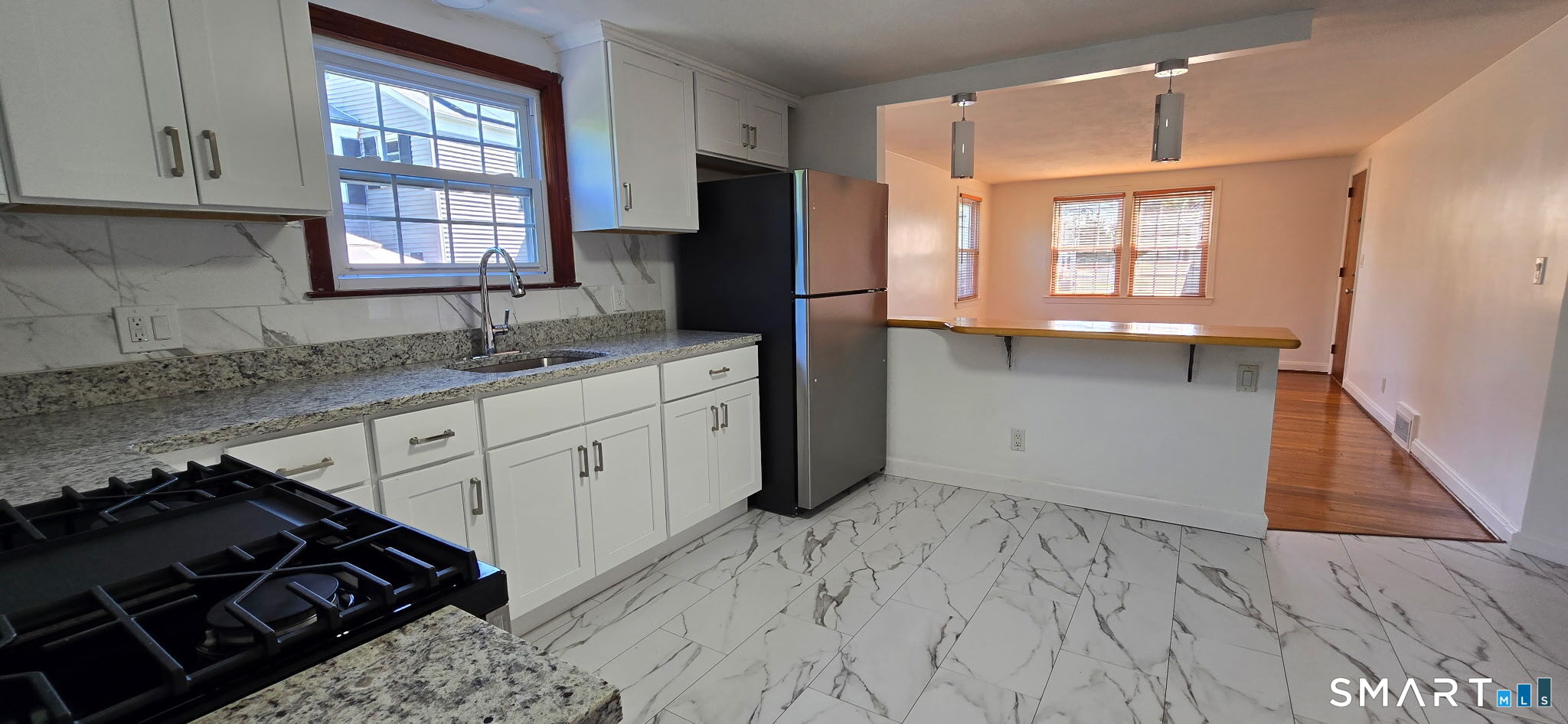 169 Arnoldale Road West Hartford, CT 06119 - Photo 6 of 11 a kitchen with a sink stove and cabinets