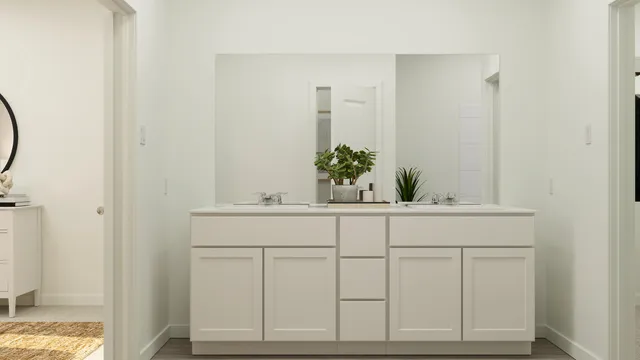 a bathroom with a sink and vanity