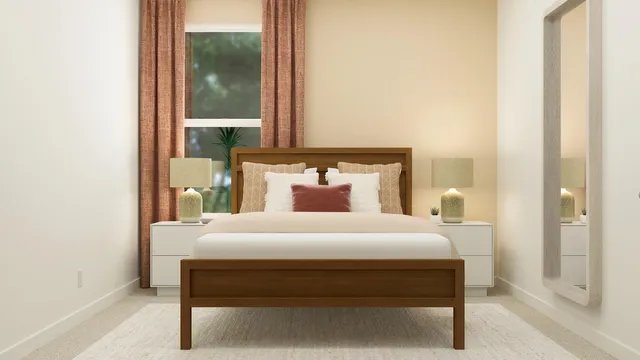 a bedroom with a bed and a mirror