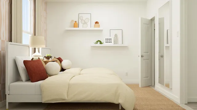 a bedroom with bed and a window