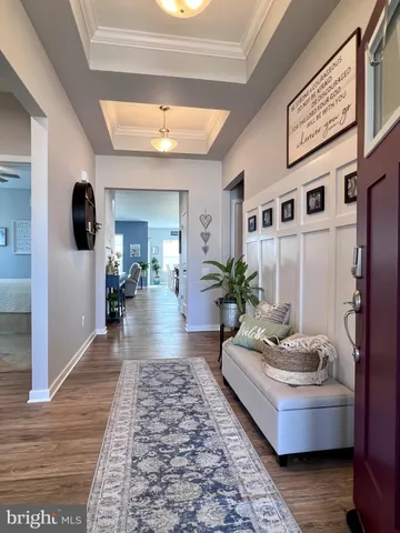 a living room with furniture and a closet