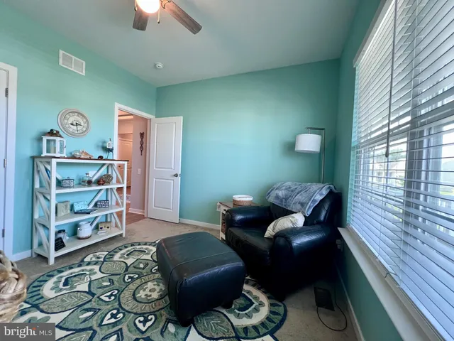 a kitchen with stainless steel appliances granite countertop a refrigerator a stove a sink dishwasher with a dining table and chairs